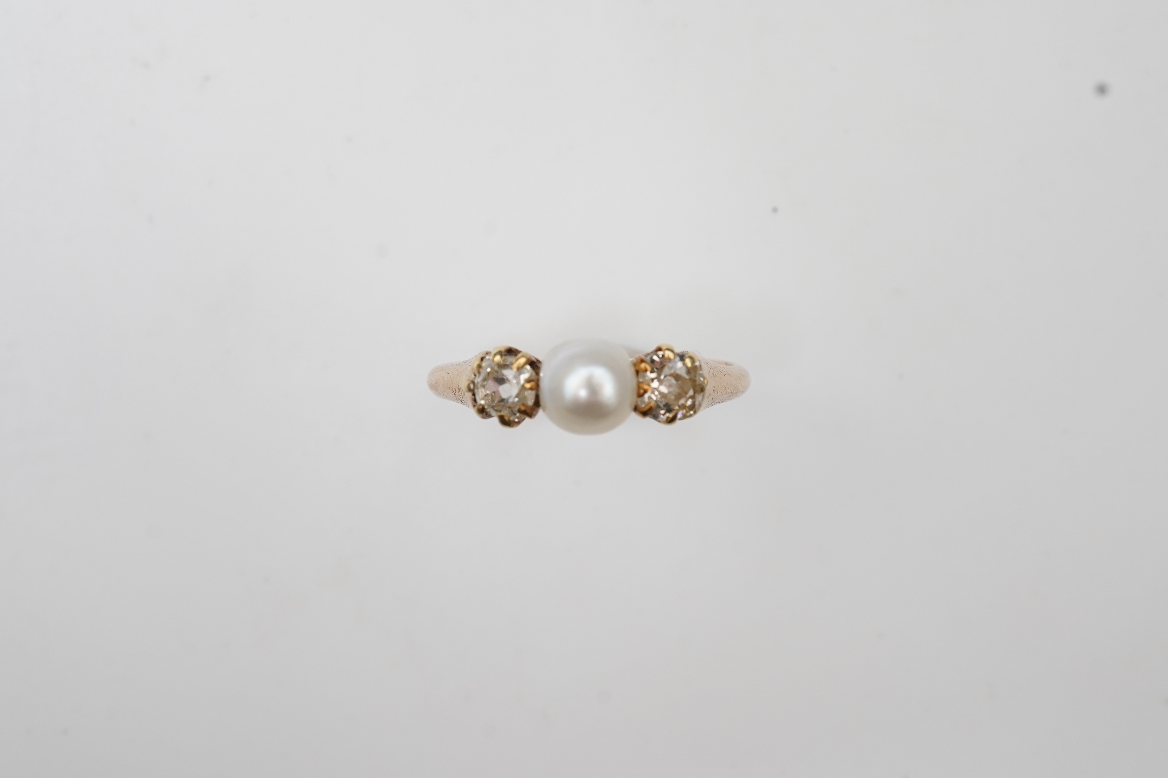A late Victorian pearl and diamond ring, circa 1900
